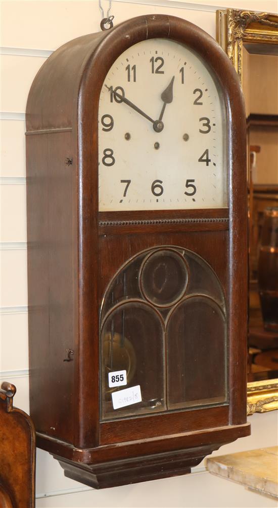 A 1920s oak wall clock H.66cm